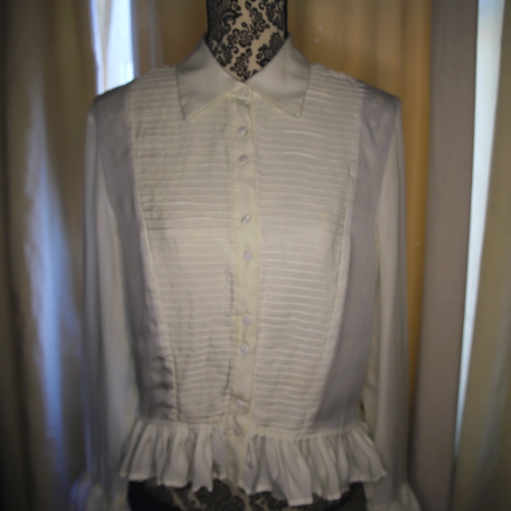 Josephine Chaus tuxedo top with ruffle sleeves and cuffs.